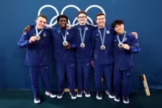 The U.S. Men's Gymnastics Team celebrates with their bronze medals from the men's team event during the Olympic Games Paris 2024 on July 29, 2024 in Paris. (Photo by Getty Images)