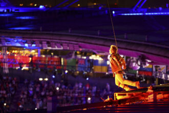 Closing Paris Games, Tom Cruise rappels down stadium, receives Olympic flag for LA