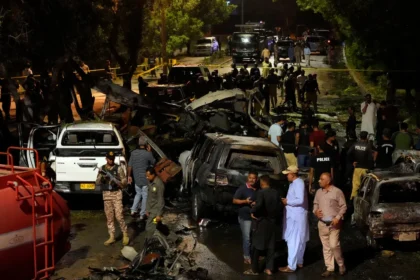 Security officials early Monday examined the site of the explosion outside Karachi's international airport.